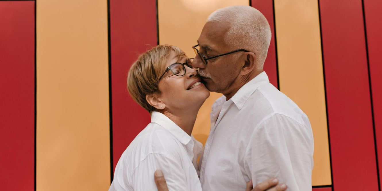 Mature Canadian couple smiling and sharing a warm moment together