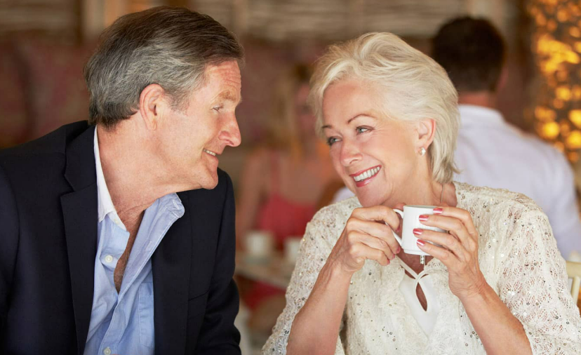 Mature couple sharing coffee and conversation