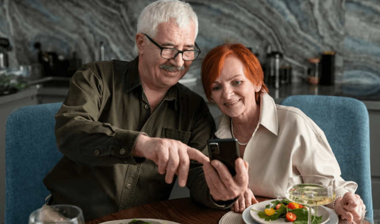 Mature couple looking through a menu together at a restaurant