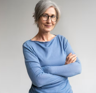Mature woman in professional attire smiling confidently