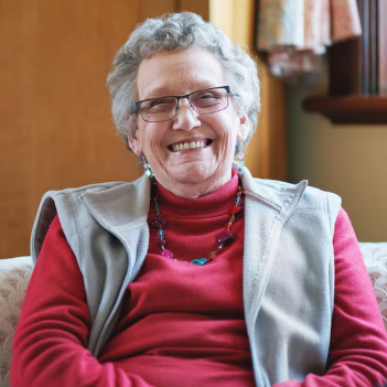 Mature woman smiling confidently indoors